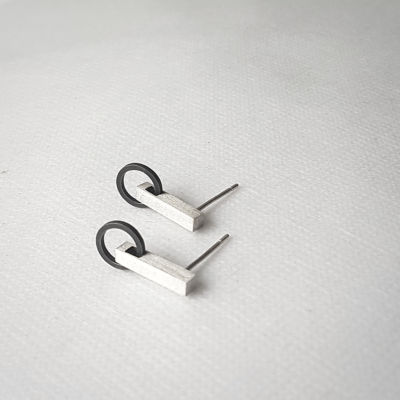 Artisan Minimalist Patina Stud Earrings in Sterling Silver is shown on the white surface.