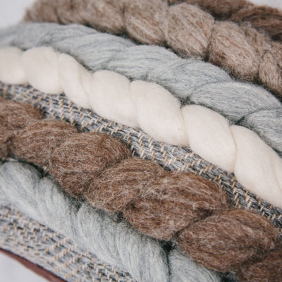 Texture detail of the handwoven rectangular 'Double Tendril' cushion featuring Blue-faced Leicester and Merino wool by Cassandra Sabo