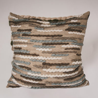 Cassandra Sabo’s handwoven Merino wool 'Caterpillar' floor cushion from her Forest Collection