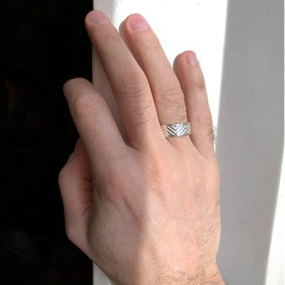 chevron hand against a wall with shadows